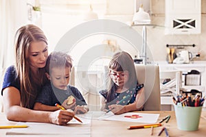 Mom drawing with her children photo