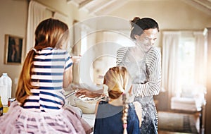 Mom, playing or kids baking with flour in messy kitchen with children siblings laughing together at home. Smile, family