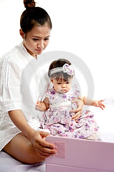 Mom is playing tablet with her baby