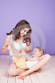 Mom playing with young son laughing joy