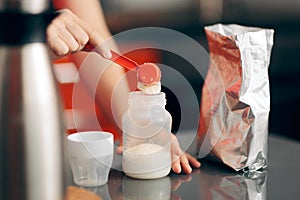 Mom Preparing Formula in Baby Bottle at Home