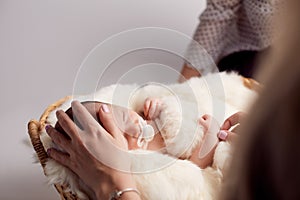 Mom putting baby to sleep. newborn two weeks . the concept of childhood