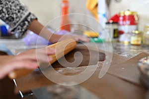 Mom rolls dough. chocolate dough. Hands working with dough preparation recipe bread. Female hands making dough for pizza. Woman`s