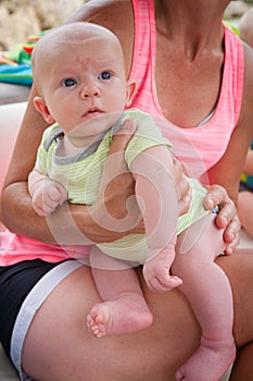 On Mom's Lap: Baby Held by Mom