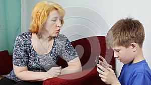 Mom scolds his son for a long time with a gadget