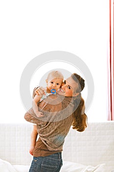 Mom showing baby something by pointing in camera