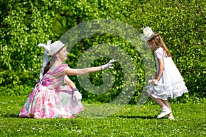 Mother and daughter in a summer park.