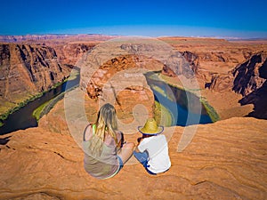 Mom and son admire panorama of Horseshoe Bend, Page Arizona, The Colorado River