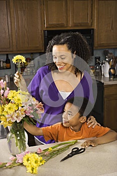 Mom and son arranging flowers