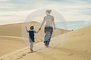 Mom and son in the desert. Traveling with children concept photo