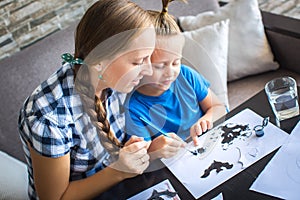 Mom with son draw a flying mouse photo