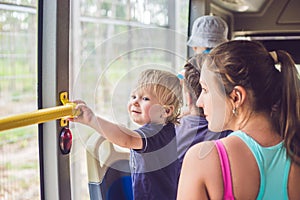 Mom and son go by bus. Traveling with children concept