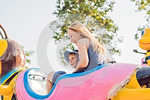 Mom and son having fun at an amusement park