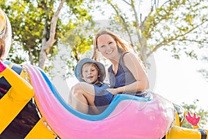 Mom and son having fun at an amusement park