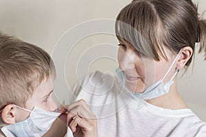 Mom with son in medical masks