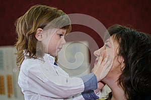 Mom and son, photo without processing. They hug nicely. Family values and family love