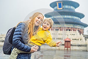 Mom and son travelers in the Temple of Heaven in Beijing. One of the main attractions of Beijing. Traveling with family