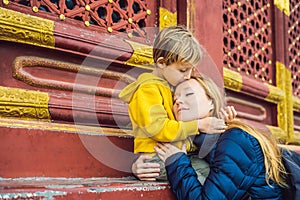 Mom and son travelers in the Temple of Heaven in Beijing. One of the main attractions of Beijing. Traveling with family