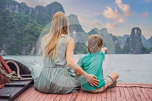 Mom and son travelers is traveling by boat in Halong Bay. Vietnam. Travel to Asia, happiness emotion, summer holiday