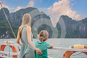 Mom and son travelers is traveling by boat in Halong Bay. Vietnam. Travel to Asia, happiness emotion, summer holiday