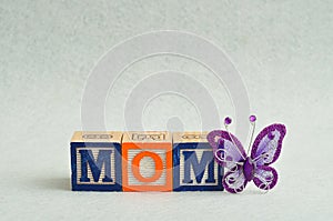 Mom spelled with colorful alphabet blocks