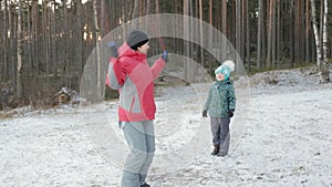 Mom teaches daughter to jump rope. Steadicam shot.