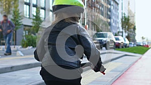 Mom teaching daughter to ride bike, family support and care, parenthood love