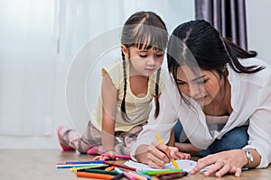 Mom teaching her daughter to drawing in art class. Back to school and Education concept. Children and kids theme. Home sweet home