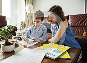 Mom Teaching Her Son Doing Homework