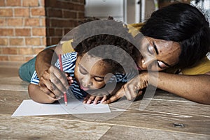 Mom teaching son how to drawing