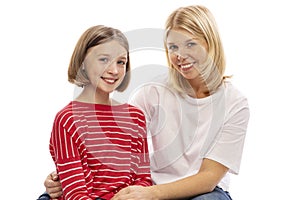 Mom and teen daughter embrace and laugh