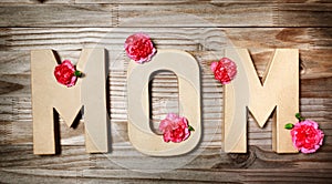 MOM text in big cardboard letters with flowers