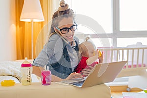 Mom with toddler working on computer