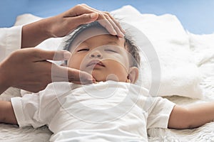 Mom is using her hands to massage Under the chin of child for to open the airway