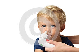 Mom using kids electric nasal aspirator photo