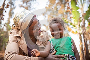 Moment of love and tenderness between African mother and daughter. Mother`s day concept