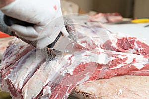 Moments of hand slaughtering of meat steaks