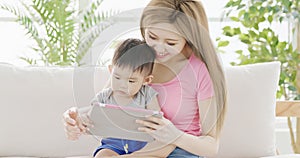 Mommy use tablet with son