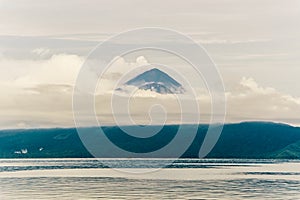 Momotombo and Momotombito volcanoes across Lake Managua photo