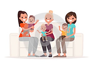 Moms are holding babies in their arms while sitting on the sofa. Communication of young mothers