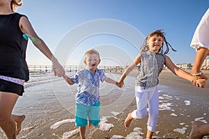 Moms and son playing on the beach