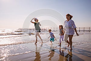 Moms and son playing on the beach