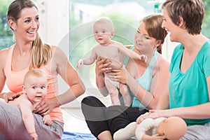 Moms and their babies practicing diaper change