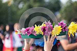 Mon people carry flowers above head, Sangklaburi