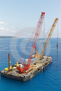 Monaco - A construction crane barge tfor land reclamation Portier Cove