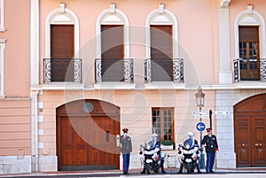 Monaco Guard and police on duty protect the duke during he goes out near the Prince's Palace of Monaco.