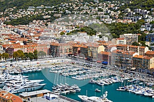 Monaco, Monte-Carlo, a lot o motor boats are moored in port at sunny day, mooring ropes go into the azure water, prows photo