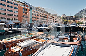 Monaco, Monte Carlo, 28 September 2022 - Riva boats in a row and a lot of luxury mega yachts at the famous motorboat