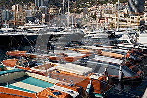 Monaco, Monte Carlo, 28 September 2022 - Riva boats in a row and a lot of luxury mega yachts at the famous motorboat