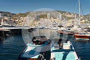 Monaco, Monte Carlo, 28 September 2022 - Riva boats in a row and a lot of luxury mega yachts at the famous motorboat